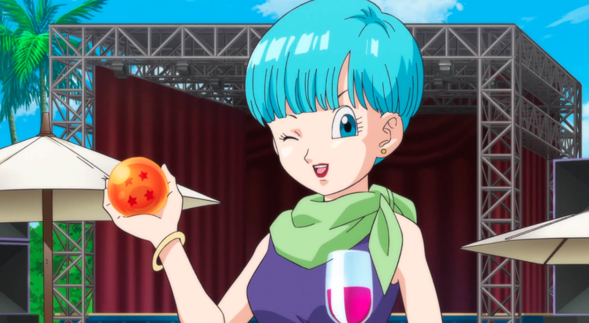 Bulma holds a dragon ball and winks at the camera