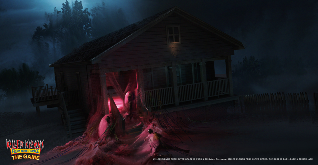 A screenshot from Killer Klows from Outer Space The Game showing a house at night with cotton candy coccoons near the front of the porch